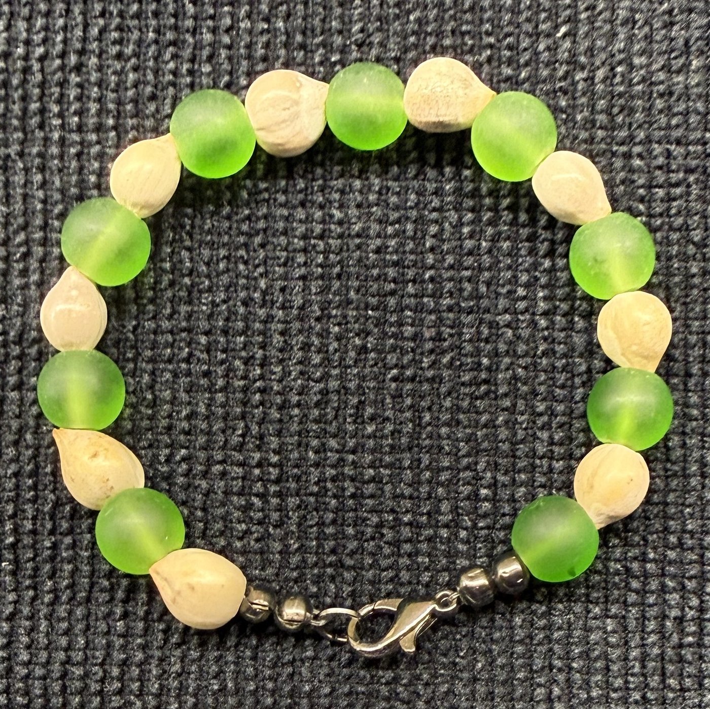 Bracelet 1, Green Peppermint, 6.5": bright lime-green frosted glass beads alternating with cream Job's tears seeds and a bronze clasp.