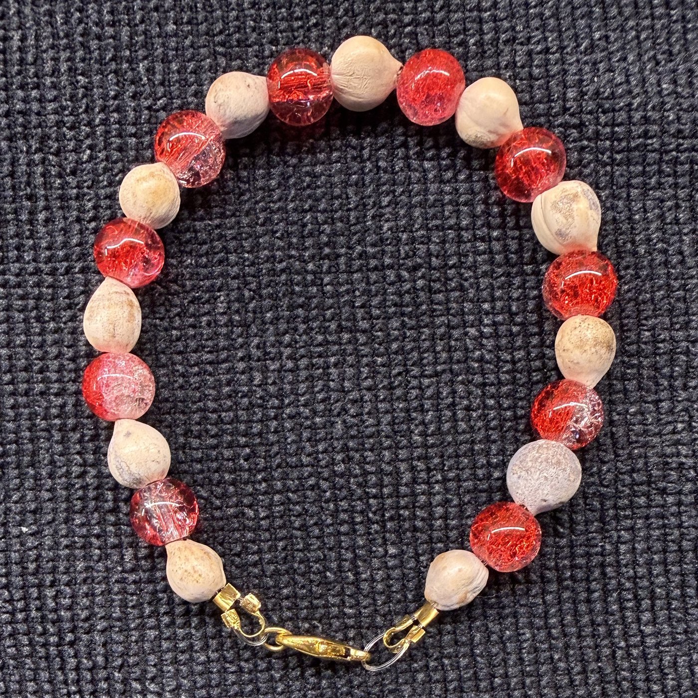 Bracelet 3, Cherry Red, 7.5": red and pink crackle glass beads alternating with cream Job's tears seeds and a gold clasp.