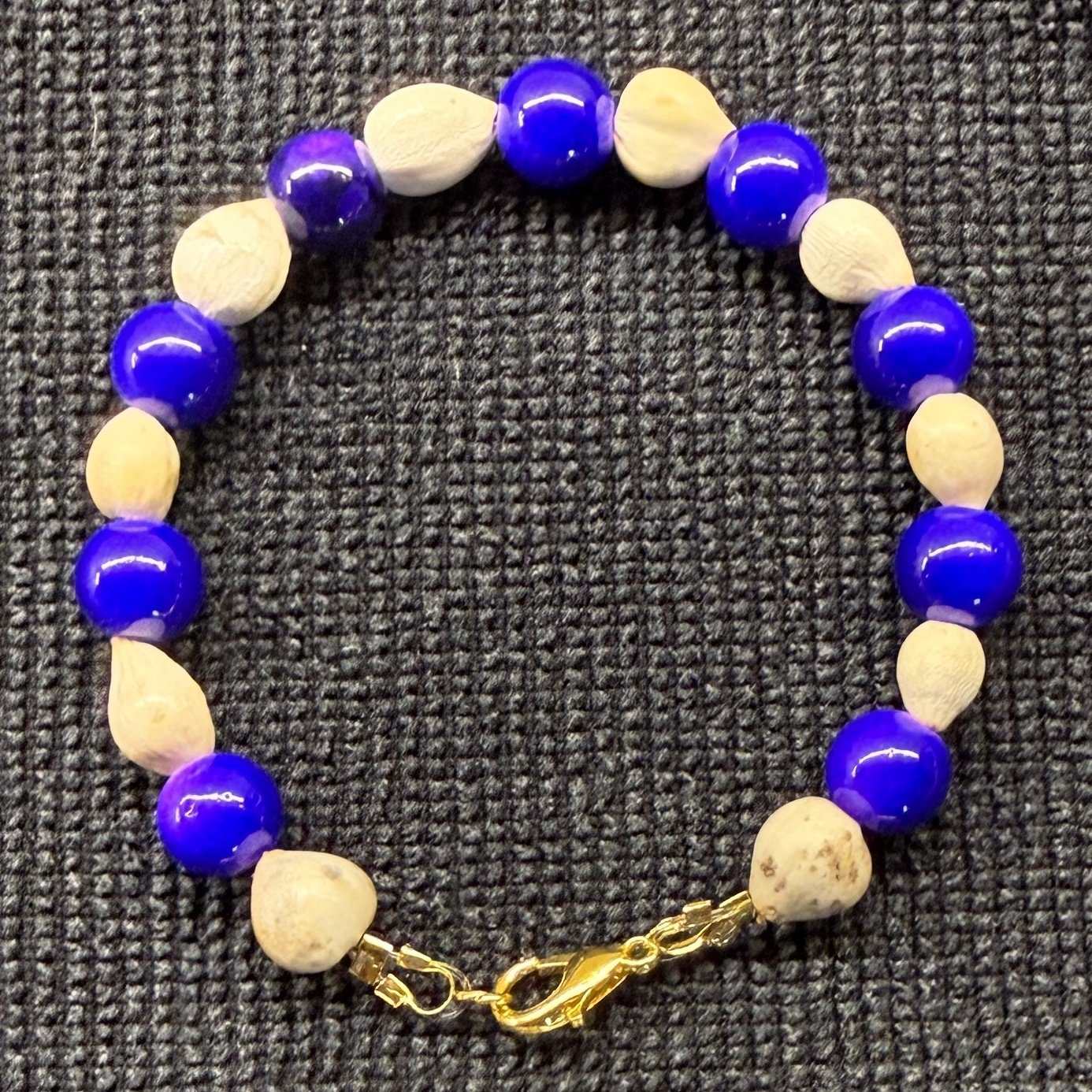 Bracelet 4, Midnight Blue, 7": deep cobalt blue glass beads alternating with cream Job's tears seeds and a gold clasp.