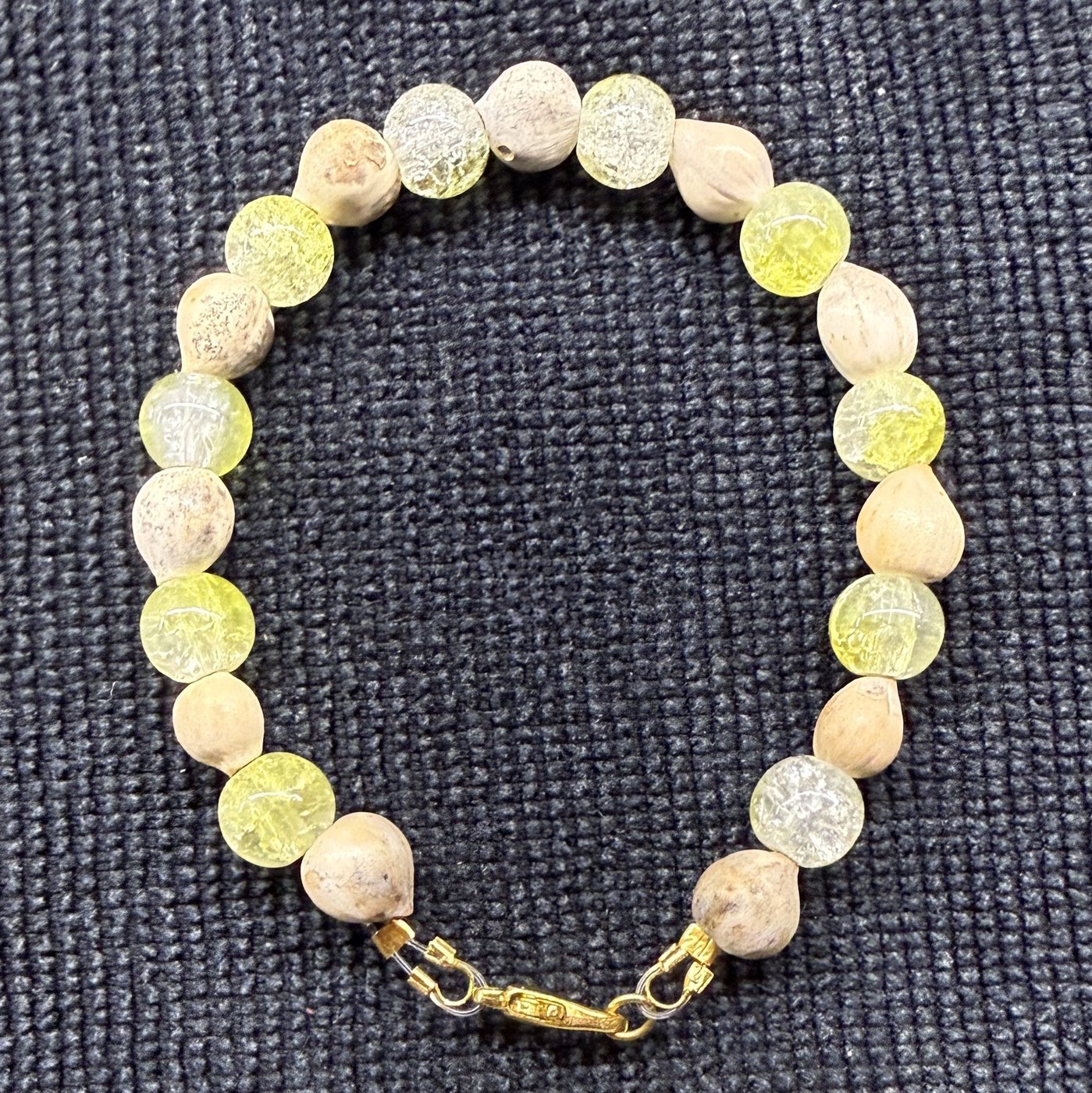 Bracelet 15, Sweet Lemonade, 7.2": pale yellow and clear crackle glass beads alternating with cream Job's tears seeds and a gold clasp.